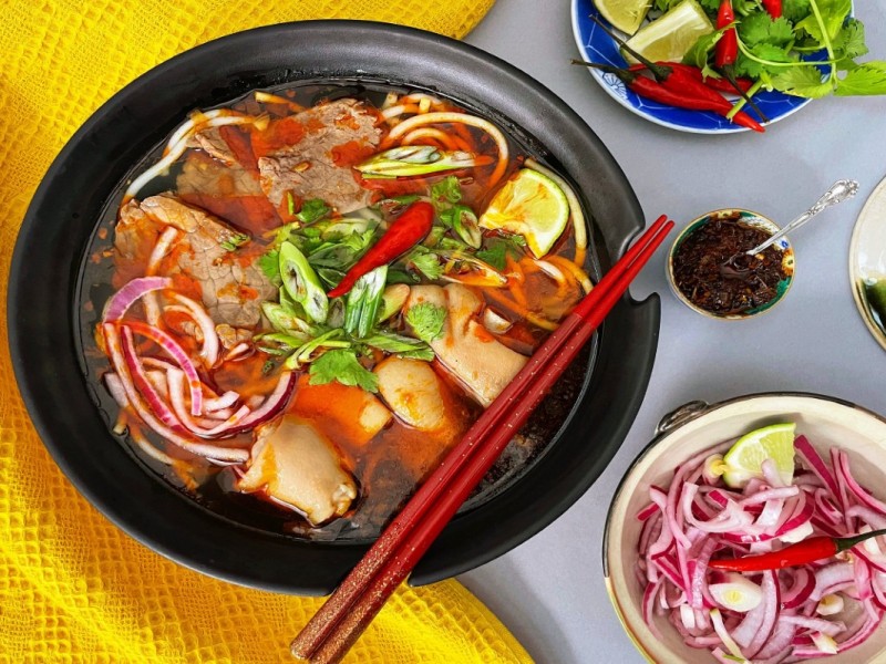 Southern-Style Pho with Rich Broth Southern-style pho with rich broth, garnished with lime, chilies, and herbs