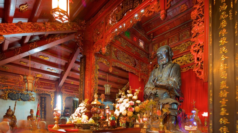 Statue of Tran Vu Deity Inside Quan Thanh Temple A statue of Tran Vu Deity inside Quan Thanh Temple, reflecting the spiritual importance of Taoism in Vietnam.