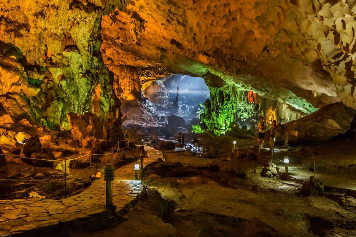 Colorful illuminated cave formations inside Sung Sot Cave Halong Bay creating a captivating natural spectacle.
