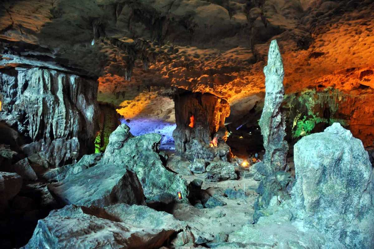 Interior pathway through Sung Sot Cave Halong Bay with prominent stalagmites and safe walking paths.