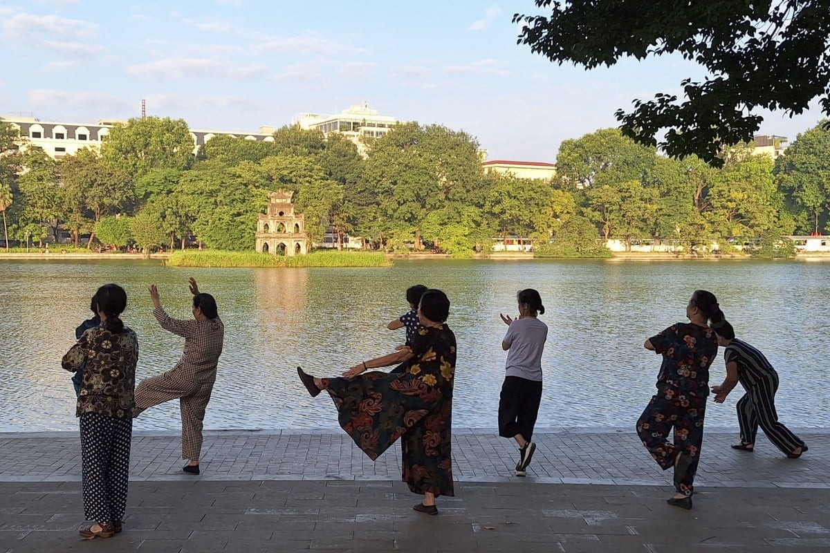 Tai Chi practitioners at Hoàn Kiếm Lake