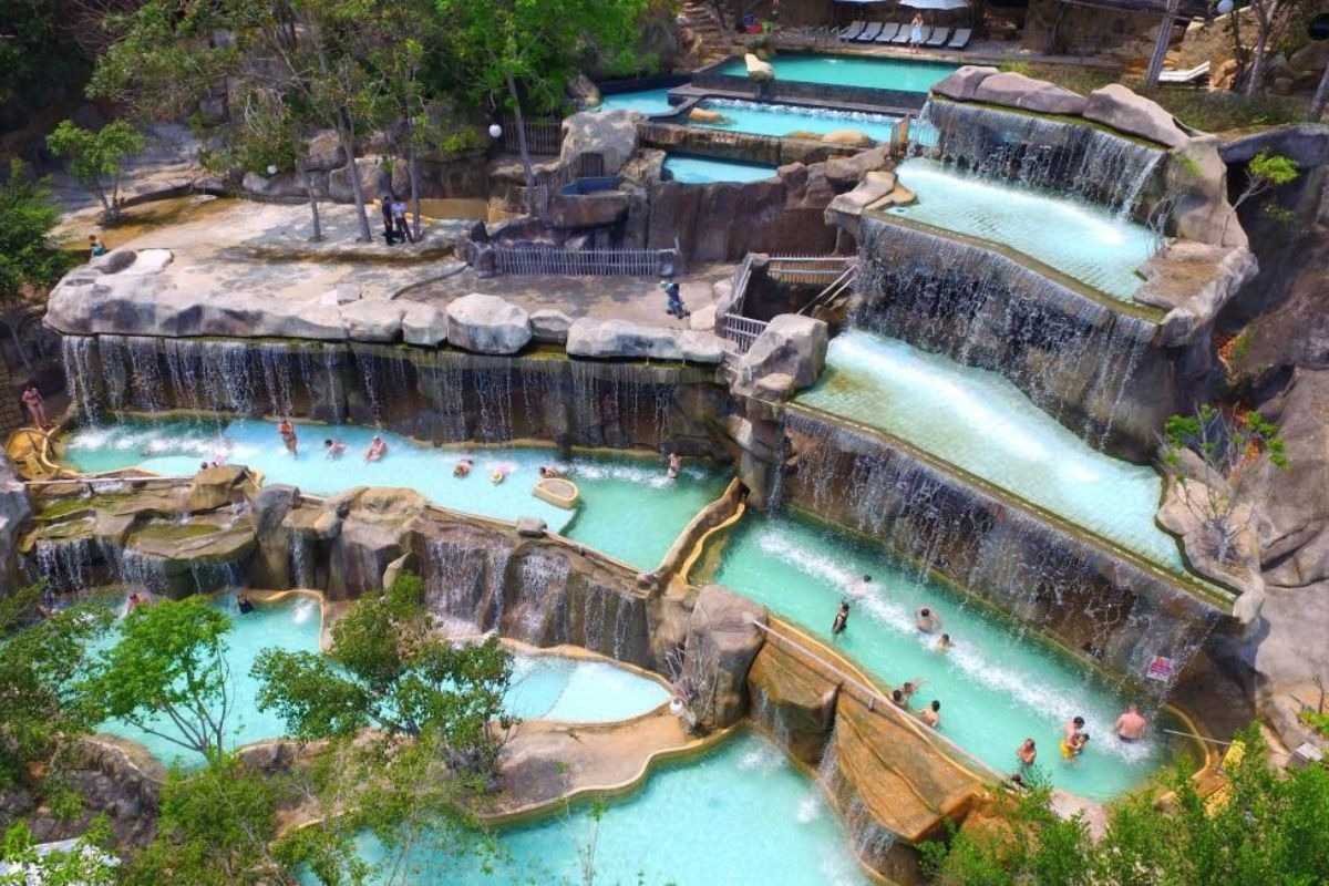 Main waterfall complex at Thap Ba Hot Springs Multi-tiered pools with cascading waterfalls at Thap Ba Hot Springs welcome guests to soak and unwind in Nha Trang