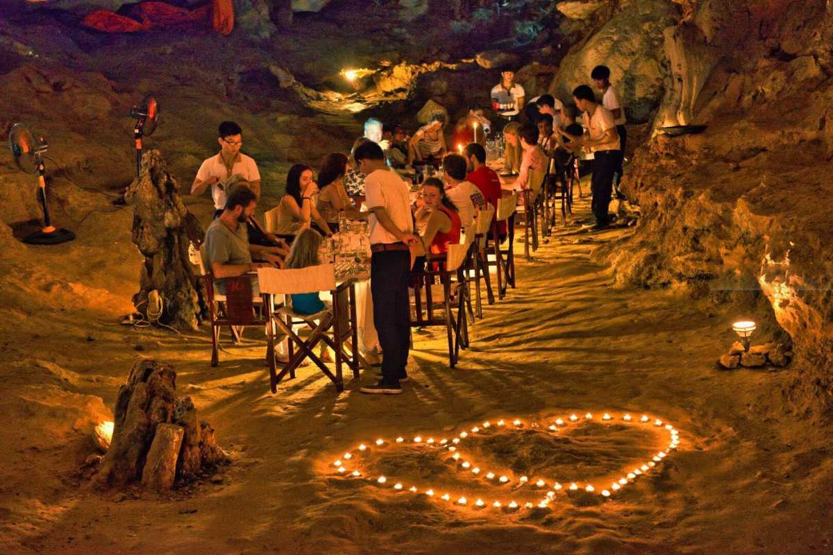 Illuminated pathway winding through Thien Canh Son Cave, leading visitors safely through the cave