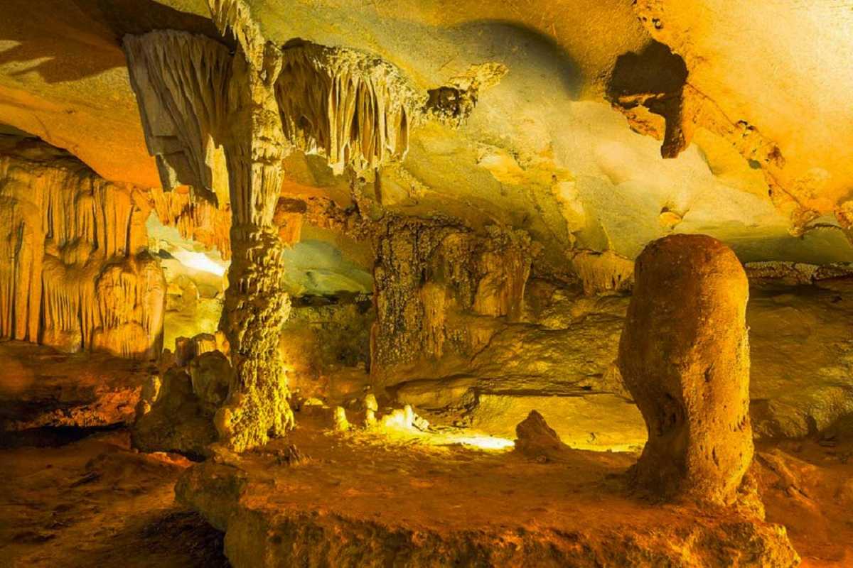 Illuminated cave chambers revealing natural formations inside Thien Cung Cave Halong Bay