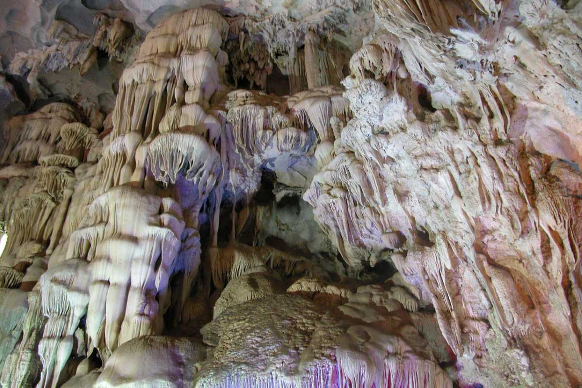 Detailed view of stalagmites and cave interior formations inside Thien Cung Cave Halong Bay