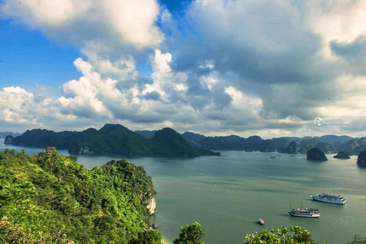 Tourists disembarking from boats onto the sandy shore of Soi Sim Island Halong Bay