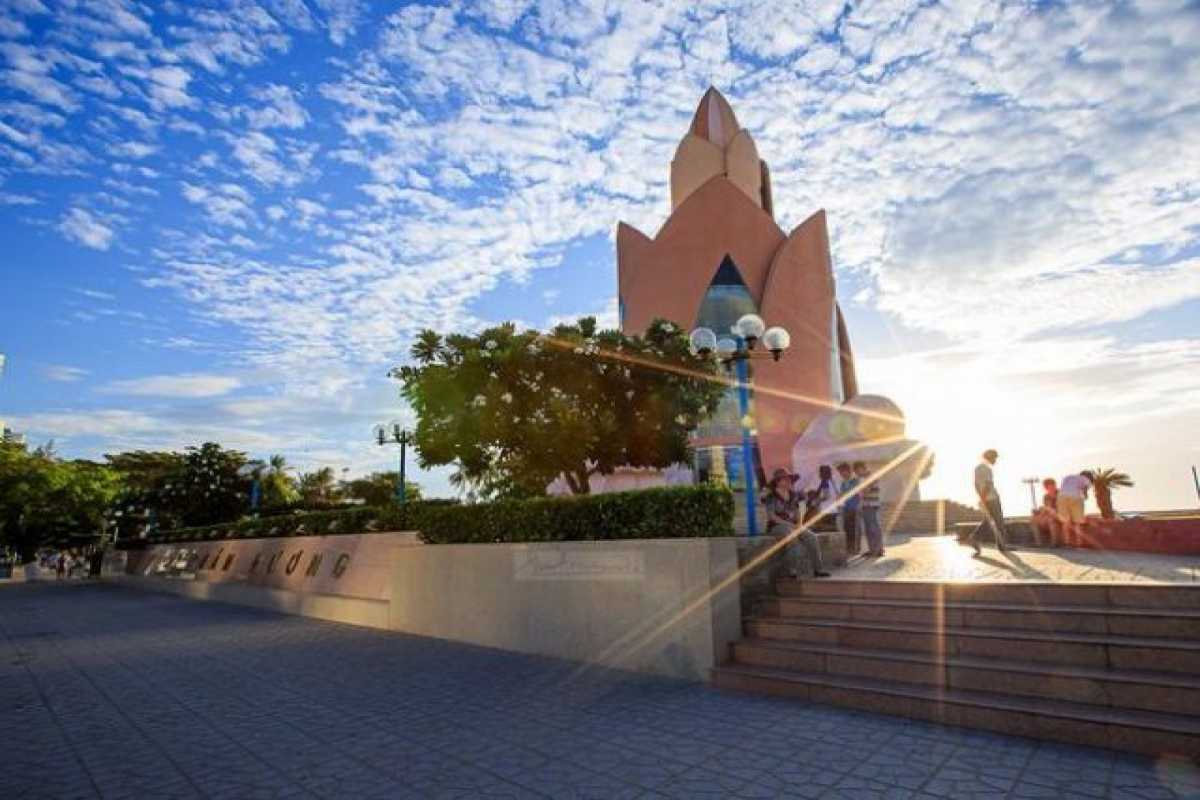 Tram Huong Tower at golden hour Golden light bathes Tram Huong Tower as the sun sets behind it, casting dramatic rays