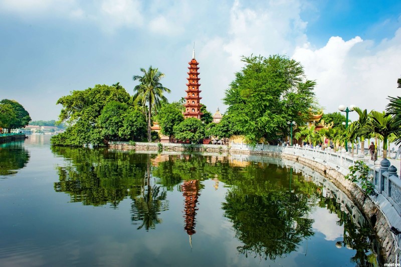 Tran Quoc Pagoda Reflection on West Lake Tran Quoc Pagoda reflected in West Lake, Hanoi, with the 11-storey stupa surrounded by greenery.