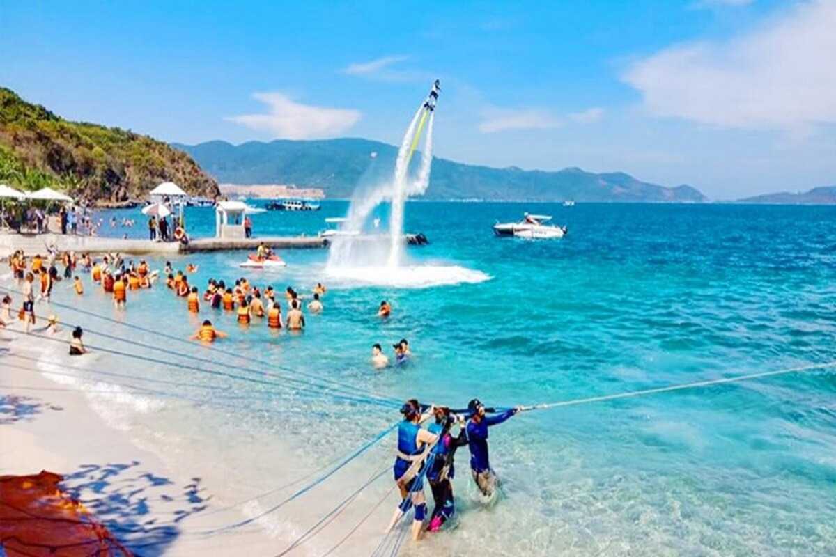 Tranh Beach Nha Trang Banana Boat Ride Group enjoying a banana boat ride on turquoise waters at Tranh Beach Nha Trang
