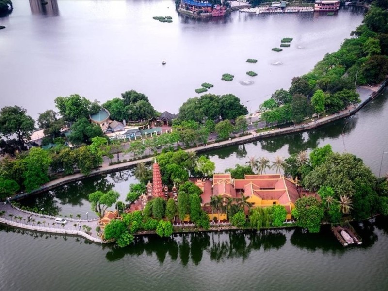 Truc Bach Lake with Nearby Temples Truc Bach Lake and nearby temples surrounded by serene greenery in Hanoi
