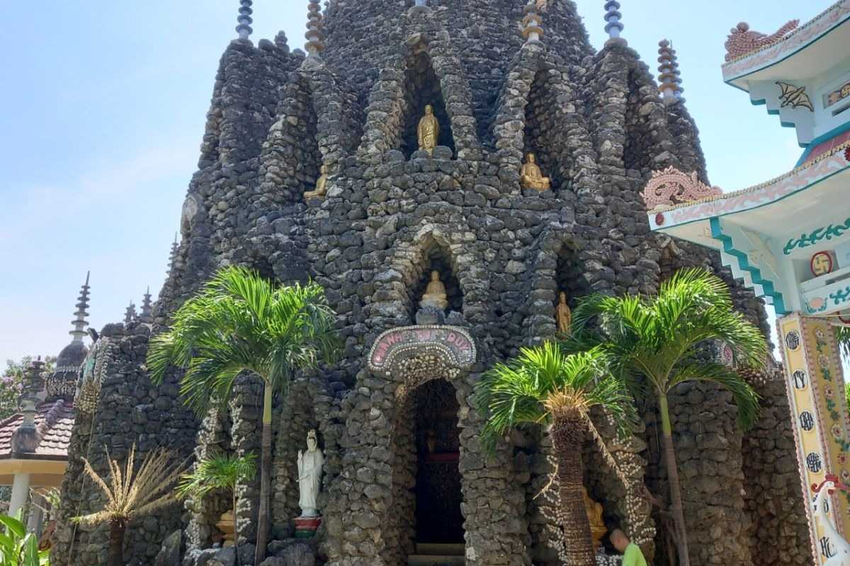 Tu Van Pagoda Nha Trang Stone Archway Covered in Shells Stone archway of Tu Van Pagoda decorated with shells and natural stones in Nha Trang