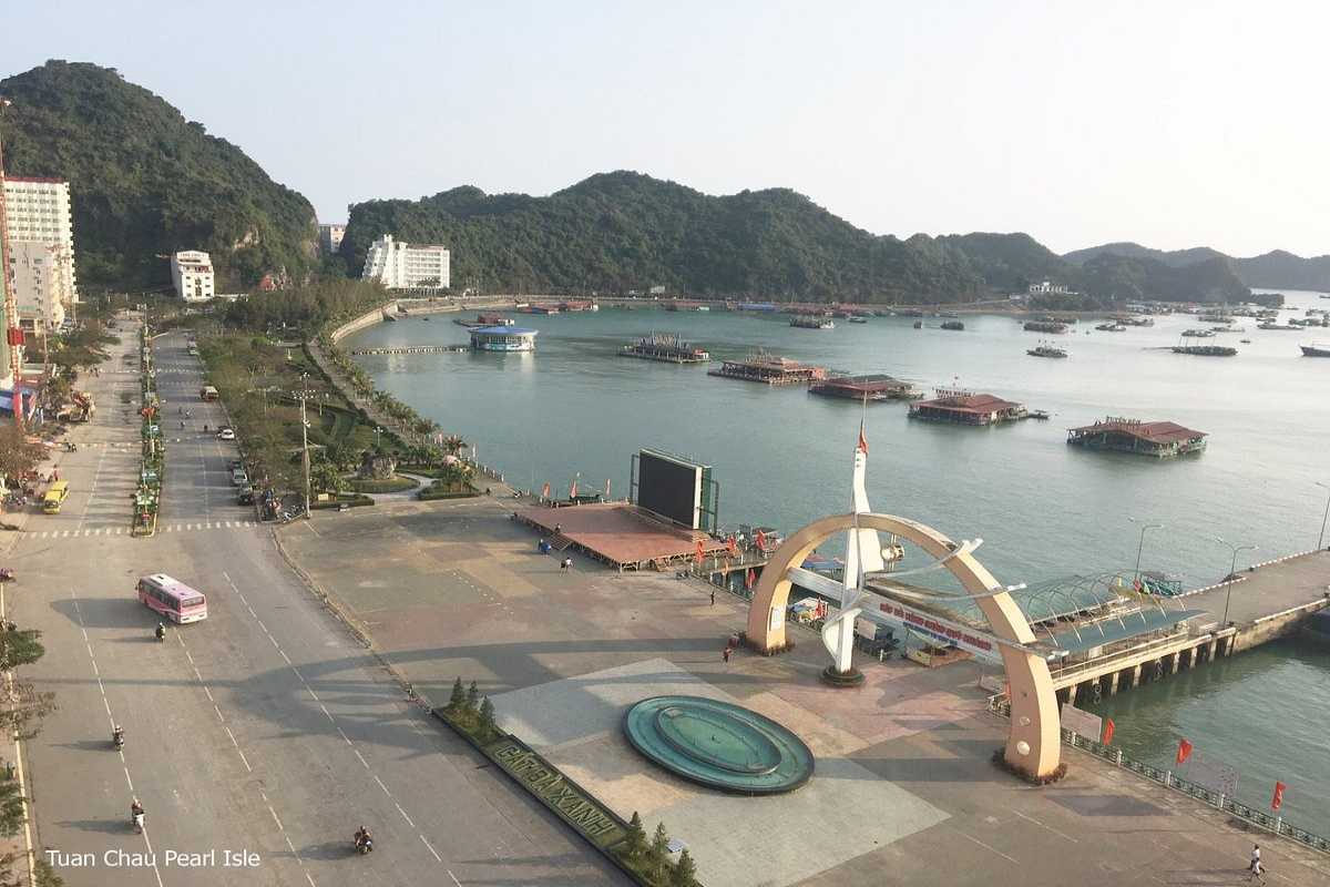 Aerial view of sandy beaches and resorts at Tuan Chau Harbor Ha Long Bay surrounded by islands