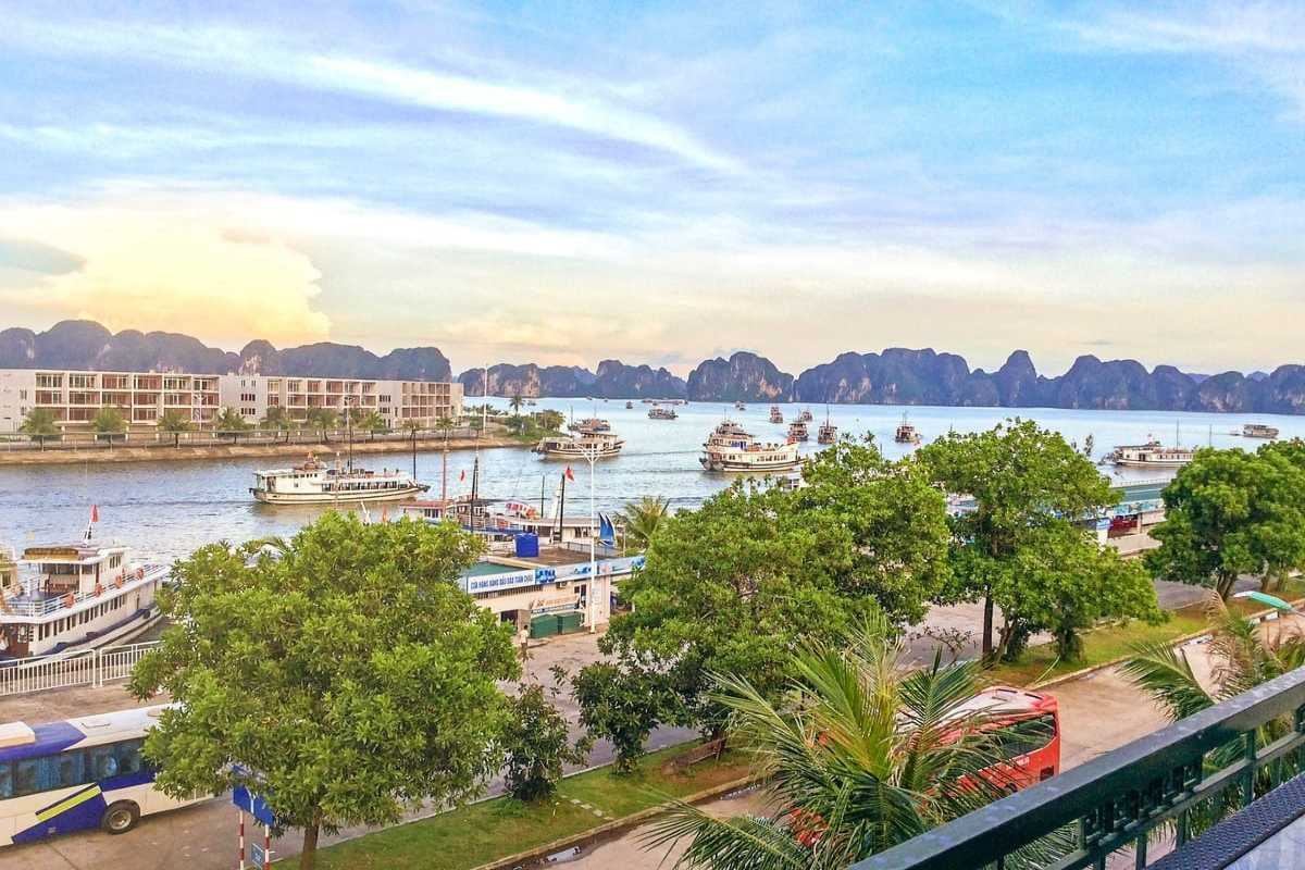 Boat traffic at Tuan Chau Harbor Ha Long Bay showing many boats navigating the calm waters