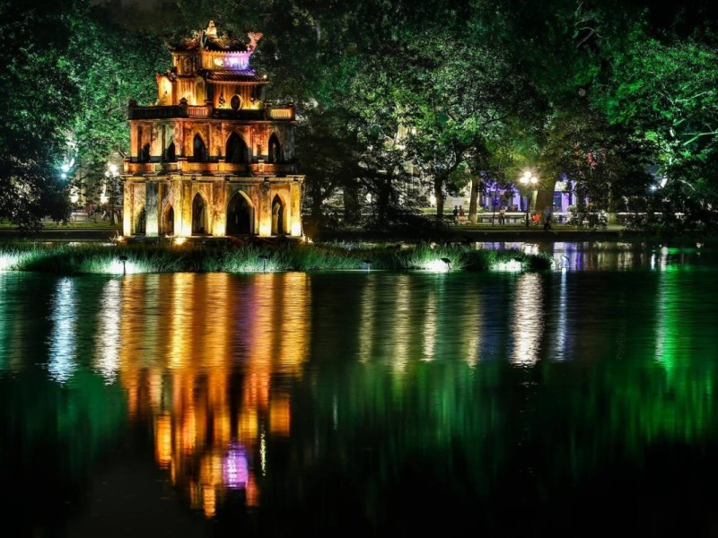 Turtle Tower Illuminated at Night Turtle Tower glowing at night in Hanoi