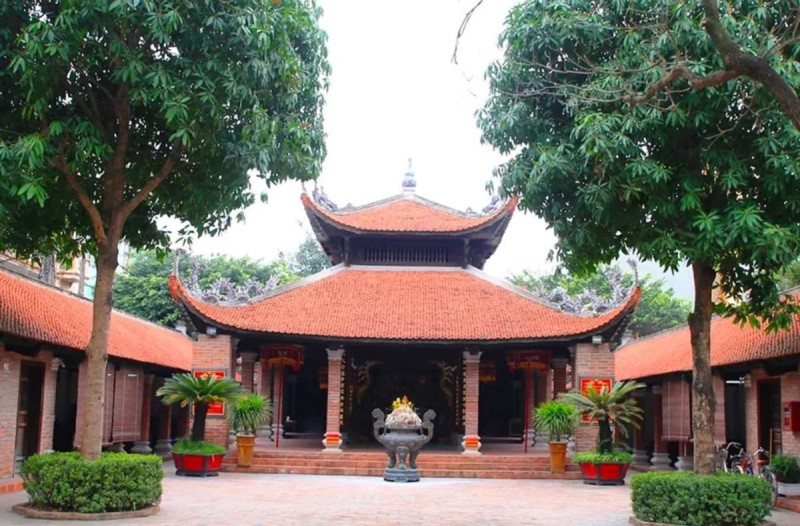 Van Phuc Silk Village Temple in Hanoi Traditional temple in Van Phuc Silk Village, surrounded by trees and cultural artifacts.