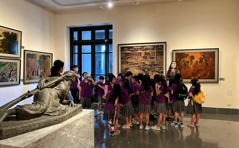 Vietnam National Fine Arts Museum Educational Tour for Students School group tour inside the Vietnam National Fine Arts Museum, with students learning about traditional Vietnamese art.