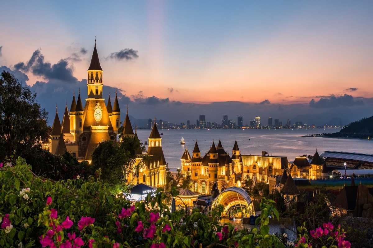 Night view of VinWonders Nha Trang illuminated with city skyline