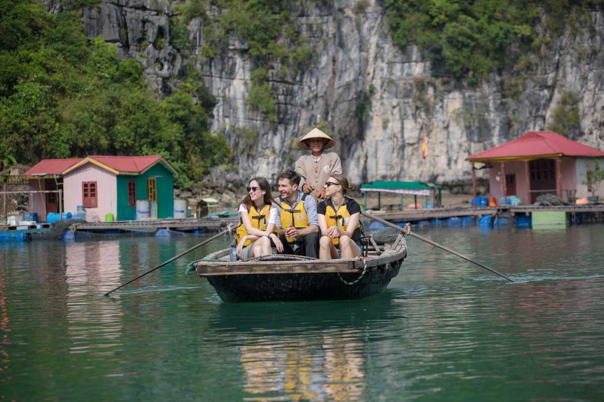 Floating raft homes with vibrant colors in Vung Vieng Fishing Village on Halong Bay