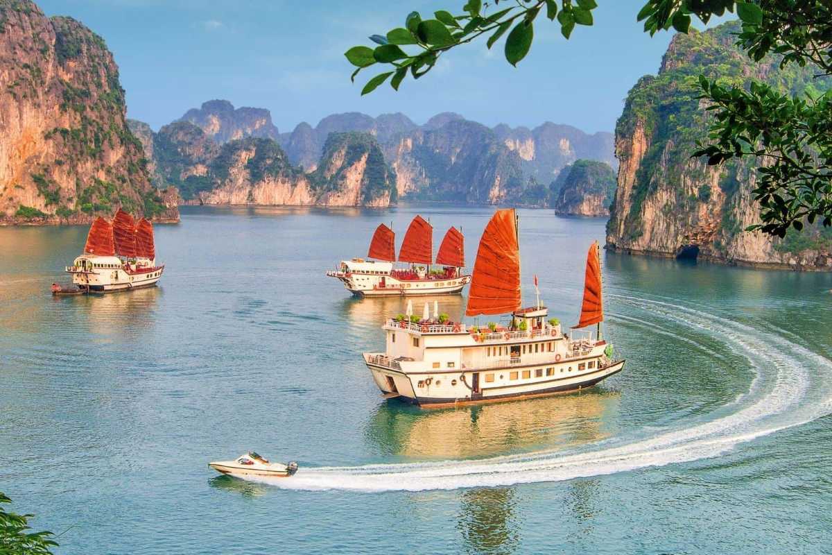 Rocky limestone island formation covered in greenery at Xep Islet Halong Bay