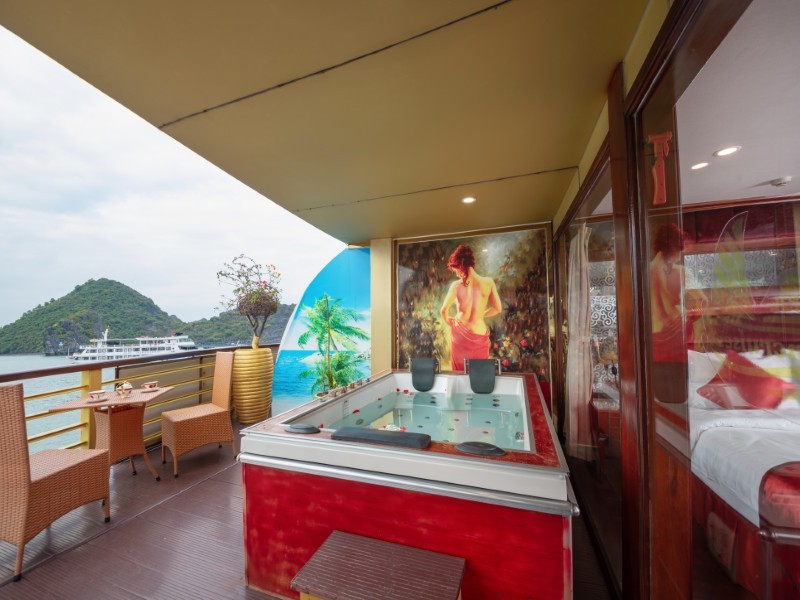 Private balcony Jacuzzi setup with floral decor and panoramic Halong Bay views on Golden Cruise.