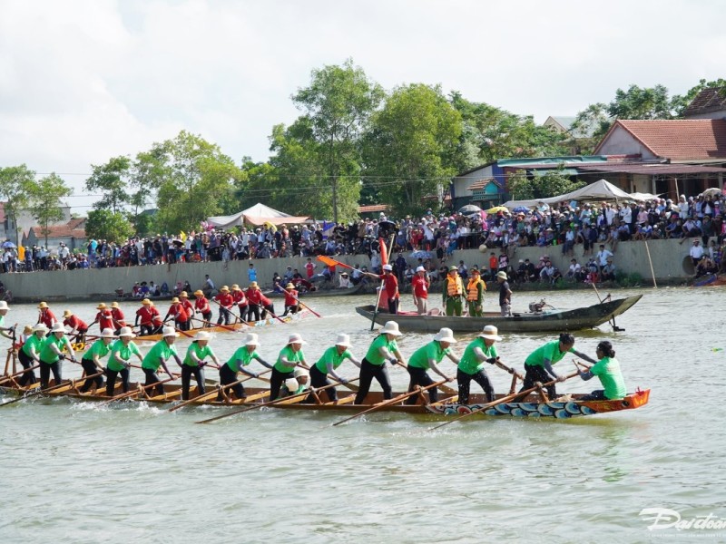 Boat Racing Festival in Quang Binh Traditional boat racing festival in Quang Binh with large crowds watching