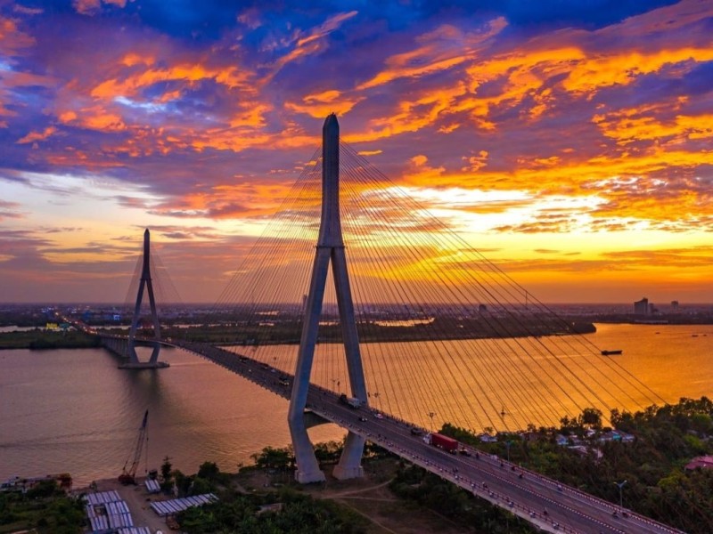 Can Tho Bridge at Sunset Can Tho Bridge at sunset, connecting Mekong Delta with a stunning sky in the background.