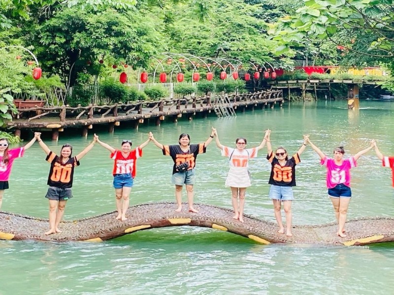 Group of Tourists Enjoying Outdoor Activity in Thai Nguyen Group of tourists enjoying a fun outdoor activity in Thai Nguyen