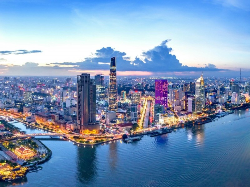 Ho Chi Minh City Aerial View at Dusk Aerial view of Ho Chi Minh City at dusk with the river and skyscrapers lit up.