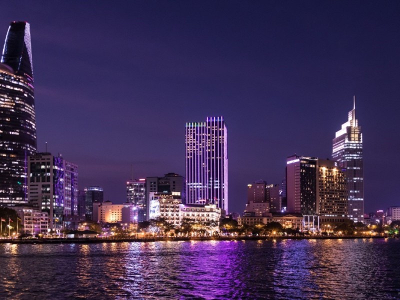Ho Chi Minh City Skyline at Night Ho Chi Minh City skyline illuminated at night with skyscrapers reflecting over the Saigon River.