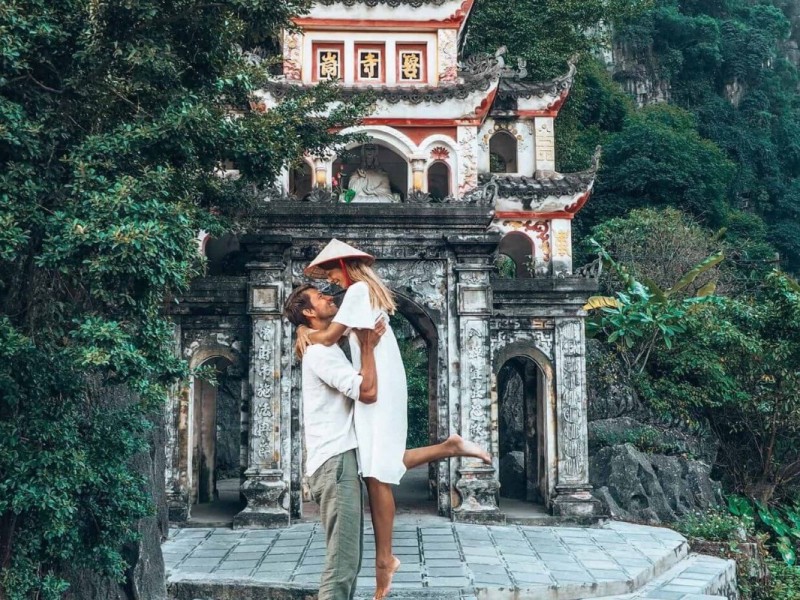 Hoa Lu Ancient Capital - Gateway to Vietnam's History Visitors at Hoa Lu Ancient Capital gate in Ninh Binh, highlighting traditional Vietnamese architecture.