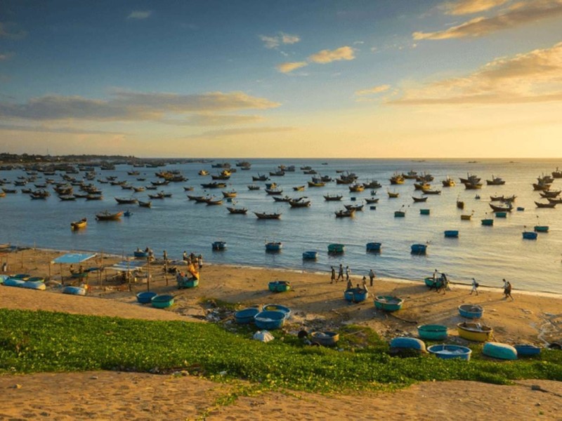 Mui Ne Village Fishermen Preparing Their Catch Fishermen at Mui Ne Village in Binh Thuan Province preparing freshly caught fish