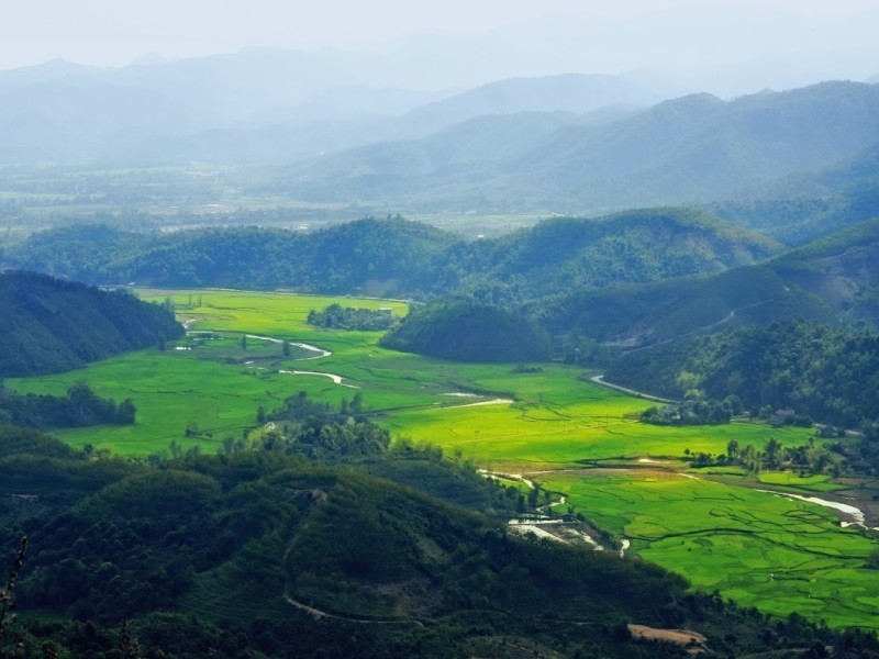 Muong Thanh Valley in Dien Bien Province Muong Thanh Valley scenic view in Dien Bien Province showing vibrant green fields surrounded by mountains