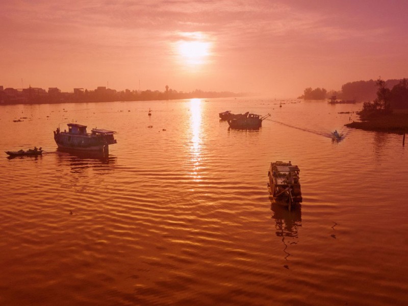 Tra On Floating Market at Sunrise Boats at Tra On Floating Market during sunrise in Vinh Long Province