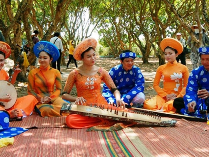 Traditional Musical Performance at Cai Mon Village Traditional musical performance at Cai Mon Fruit Garden Village, with performers in traditional costumes in Ben Tre.