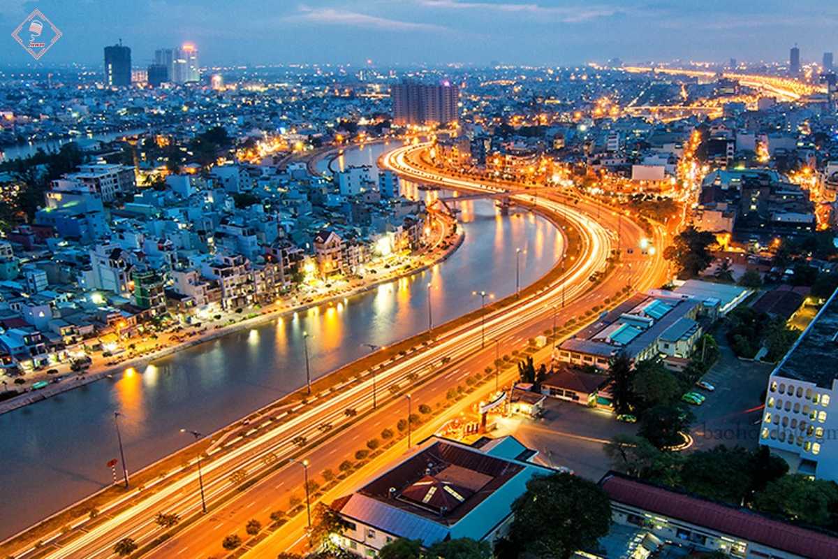 Night view of Vinh Long city and river lights Nighttime aerial view of Vinh Long city with bright river and street lights reflecting on the water