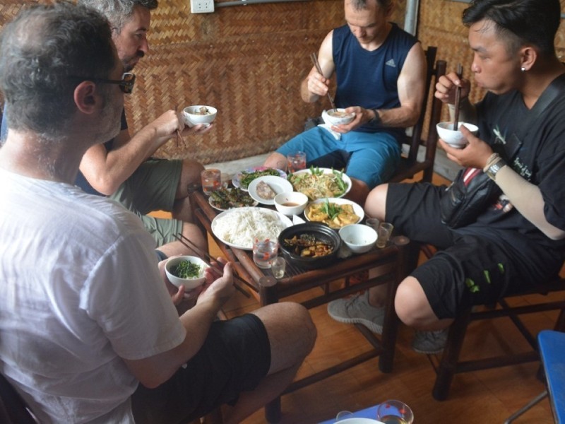 Travelers enjoying a traditional Vietnamese lunch
